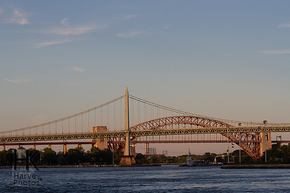 The bridge in the background is the oldest bridge in New York.  It's a railroad bridge